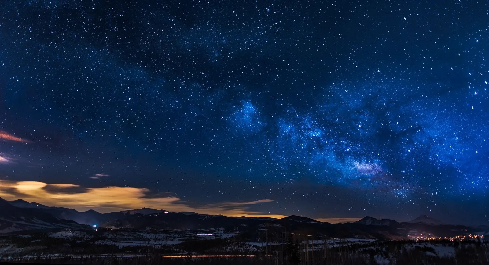 The Milky Way over dark mountains
