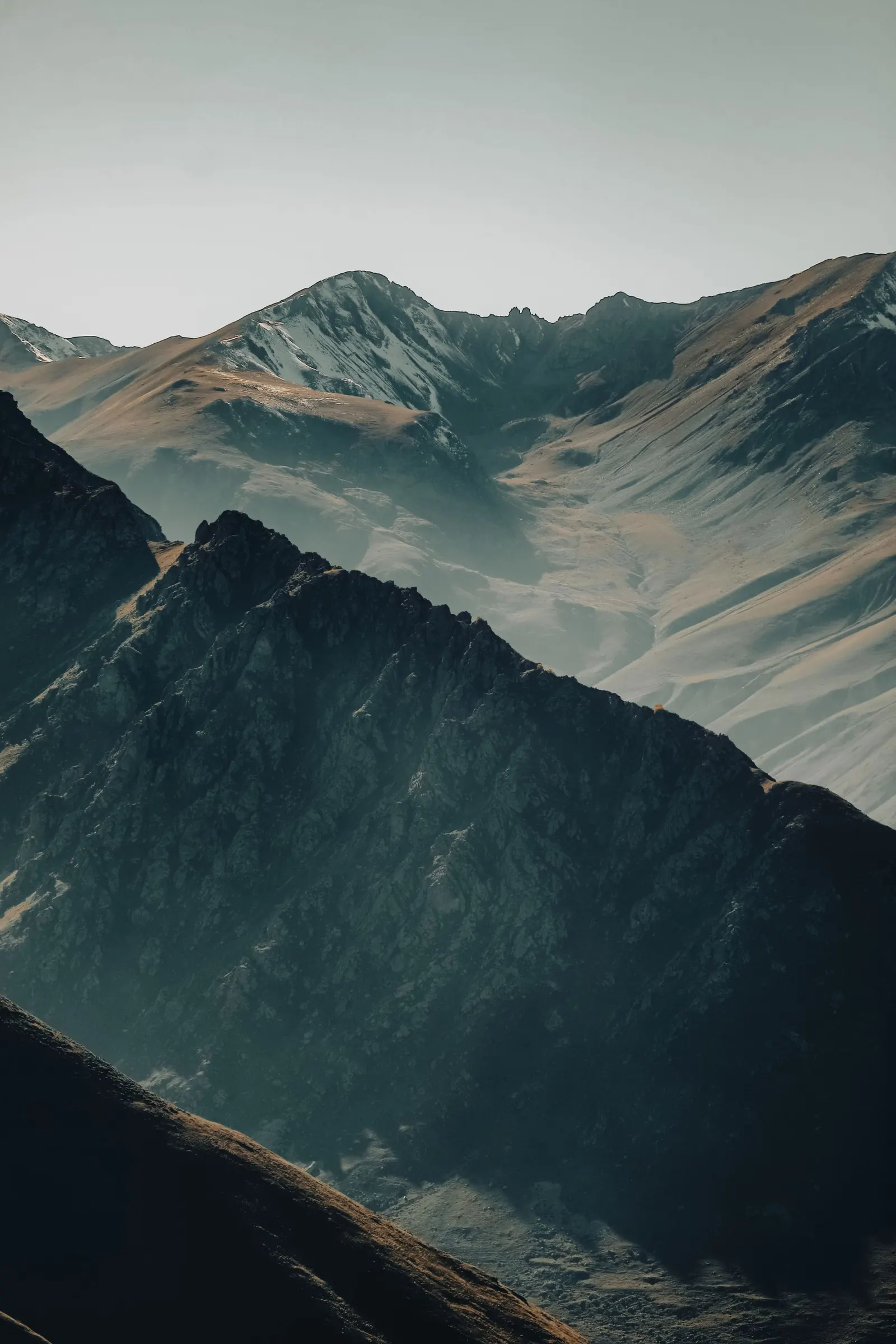 A rugged mountain range in early morning light