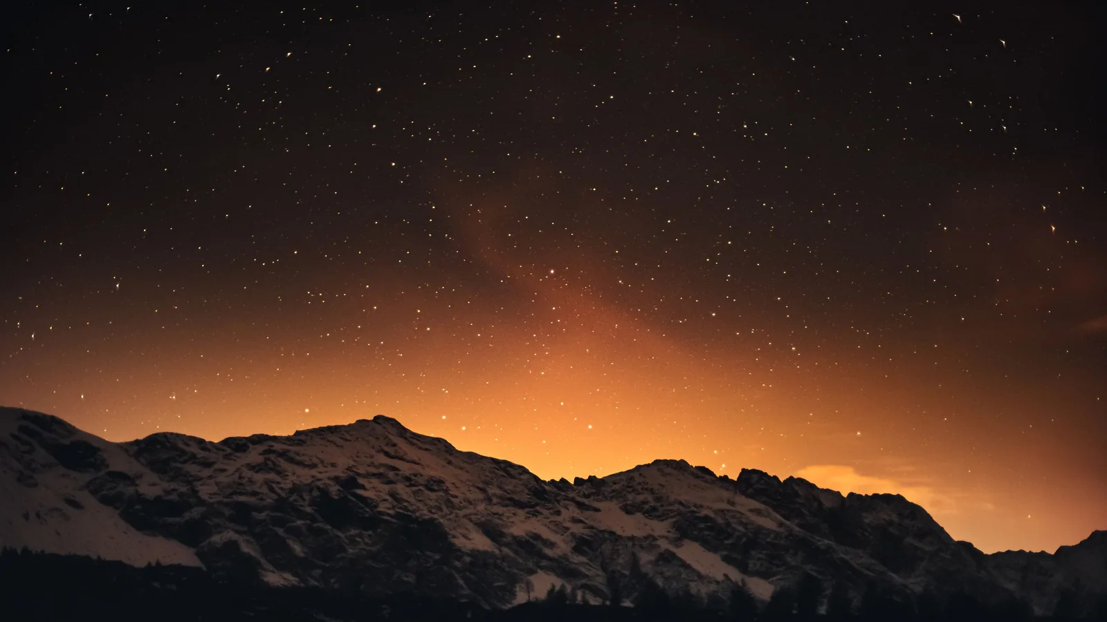 Snowy mountains in Italy under a starry sky