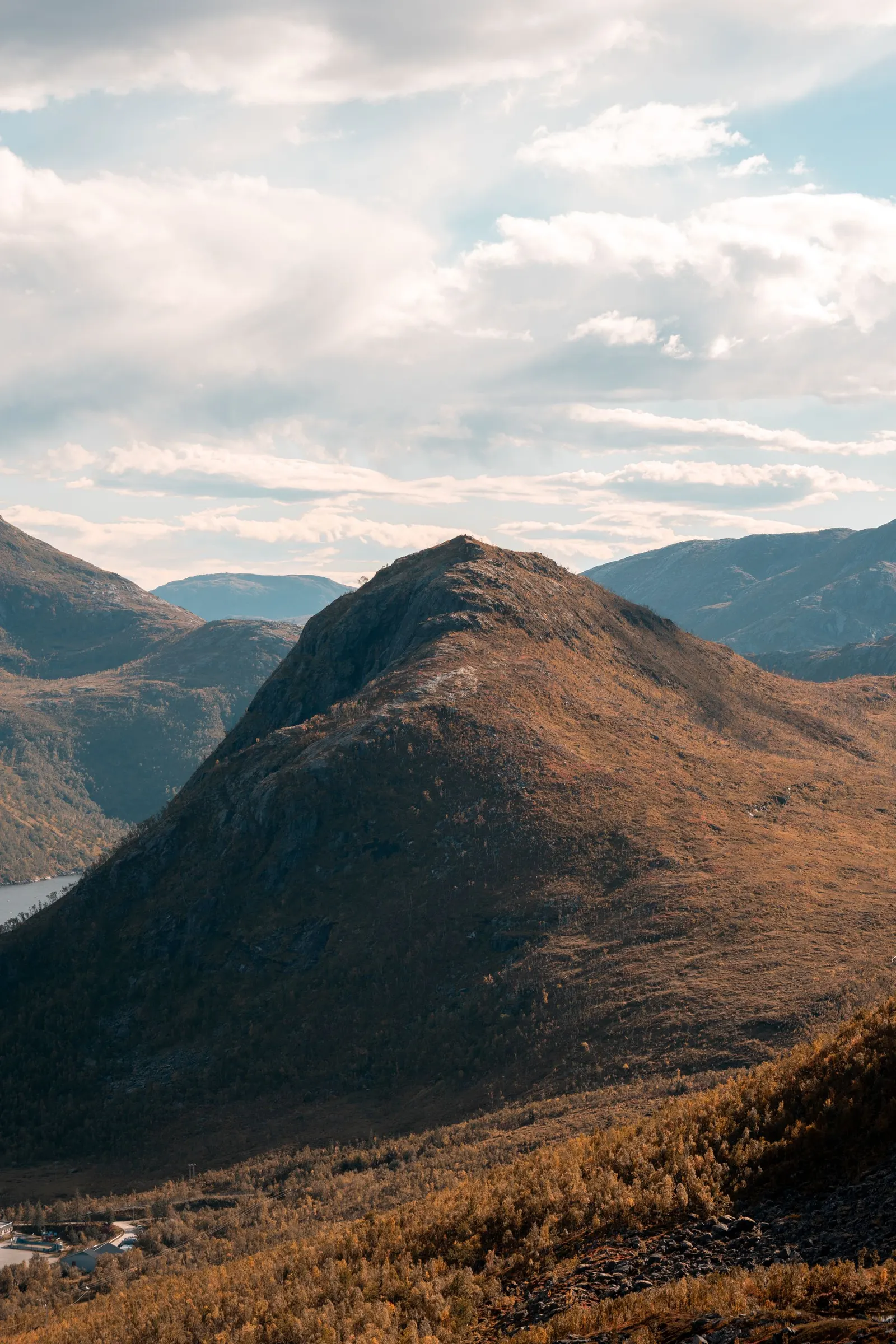Mountain peaks near Tromsø, Norway, under a bright sky